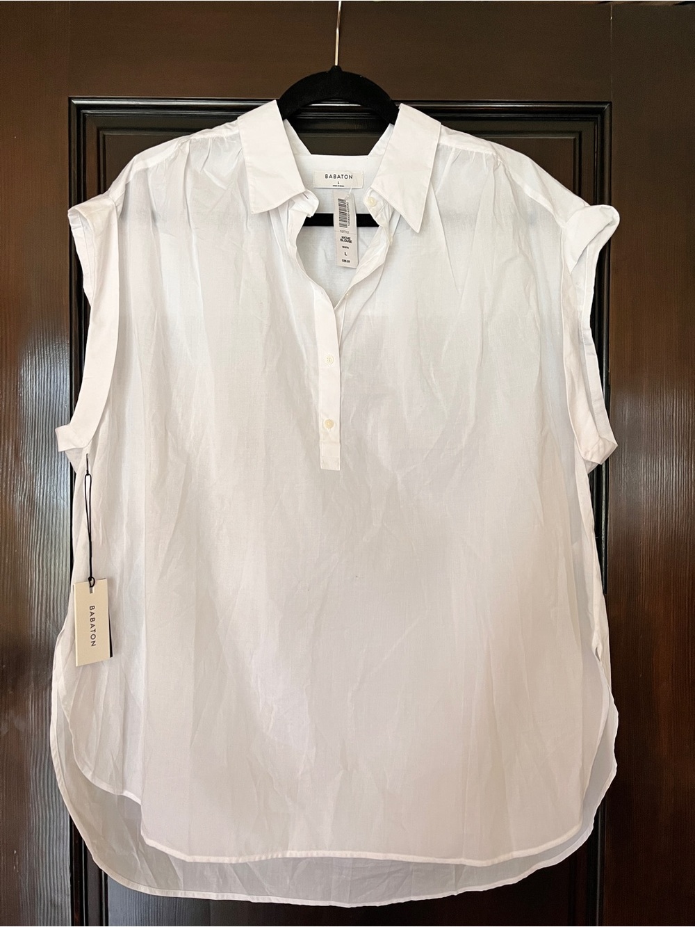 Babaton Niche Blouse White Sleeveless
NWT Large